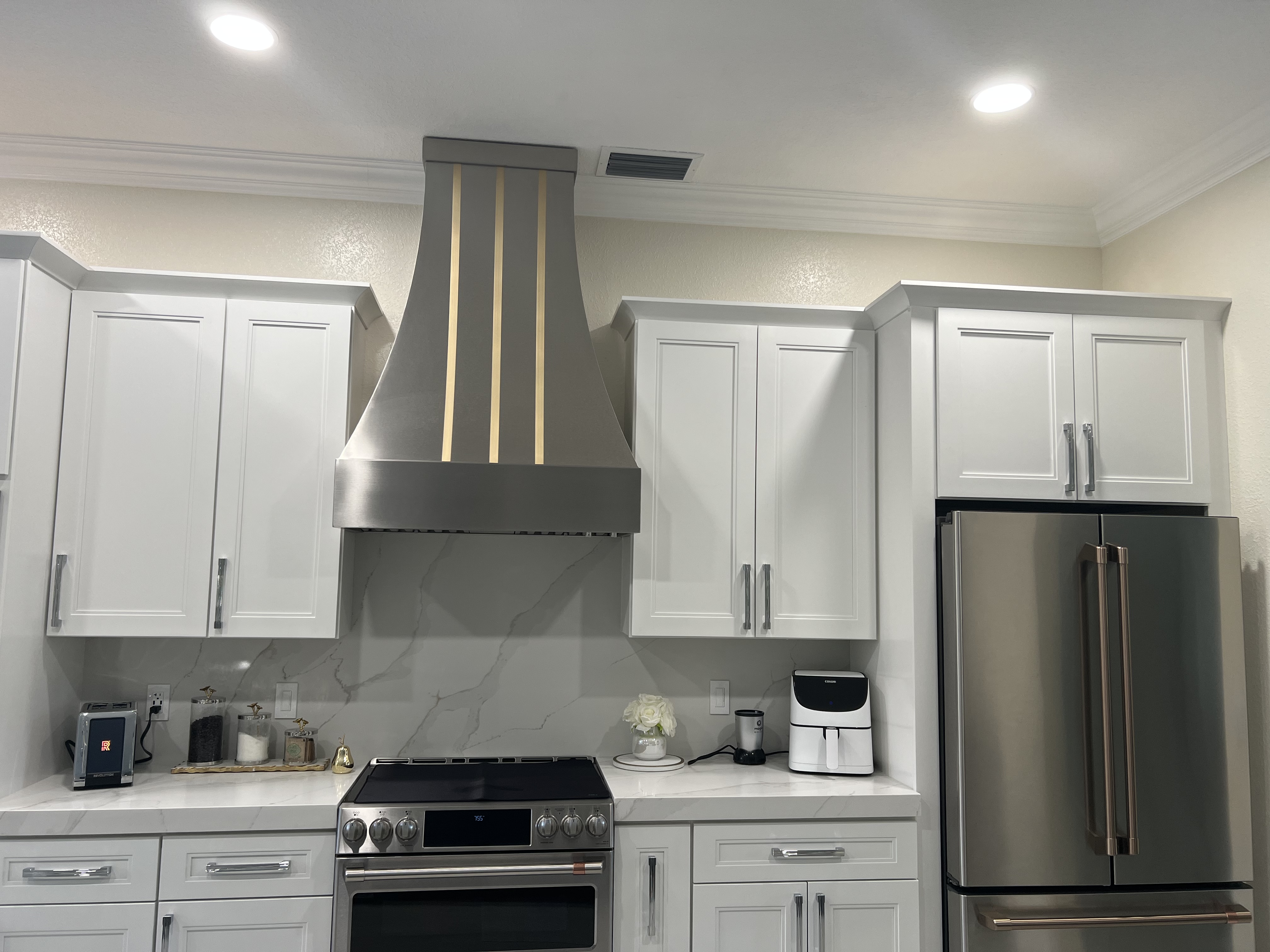Sleek Stainless Steel "Charlotte" Hood with Brass Straps