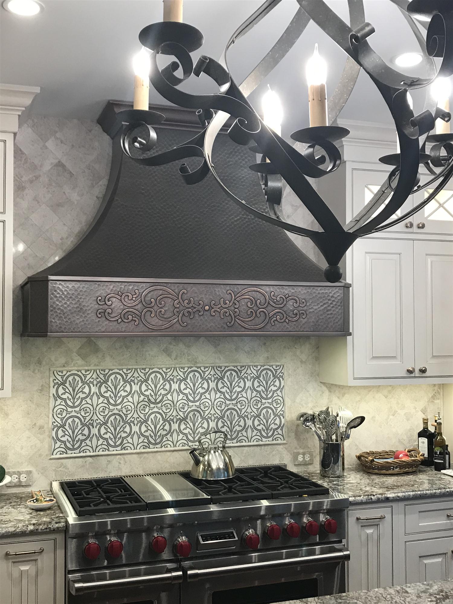 Traditional hammered copper vent hood makes kitchen beautiful